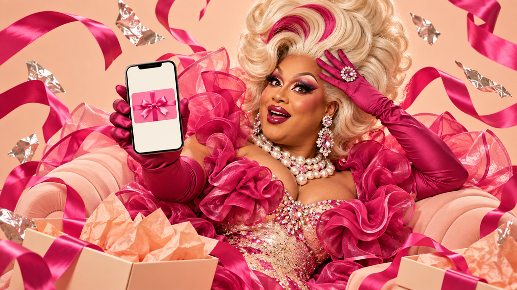 Drag queen in pink ruffles and jewels holding a phone displaying a gift card, surrounded by peach gift boxes and pink ribbons.
