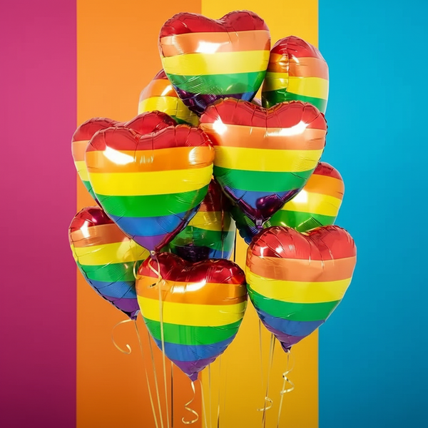 Set of 10 heart-shaped foil balloons with rainbow stripes, inspired by the LGBTQ+ pride flag, perfect for queer party decor.