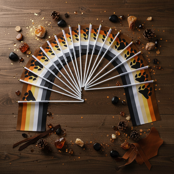 Fan of hand-held bear pride flags with white sticks on a rustic wood surface