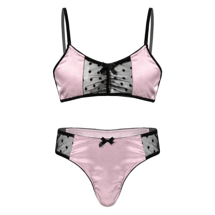 Front-facing pink satin lingerie set with black mesh polka-dot panels and bows