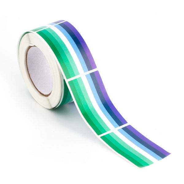 Roll of green, white, blue, and purple striped pride stickers with a strip unrolled