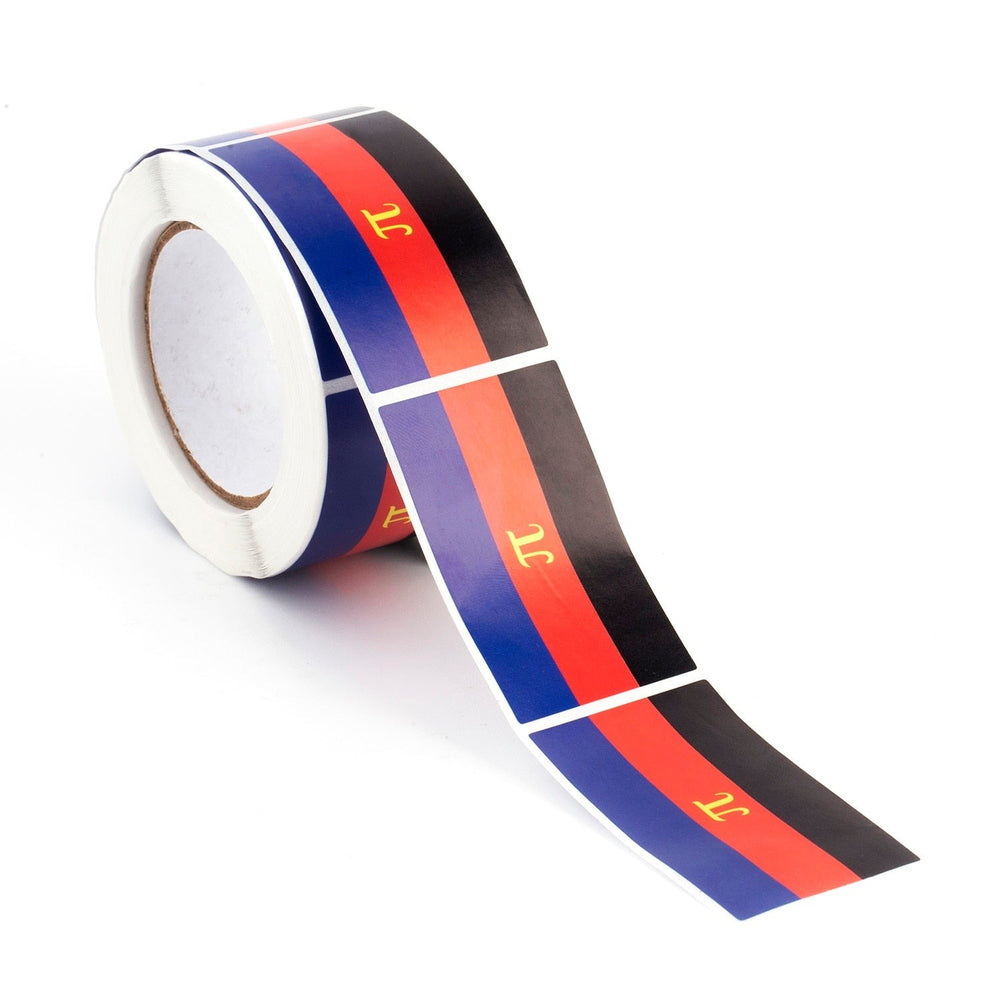 Roll of polyamory pride flag stickers unspooling across a white surface