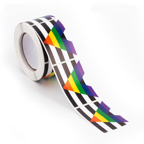 Roll of black-and-white striped stickers with repeated rainbow arrow designs unspooling on white