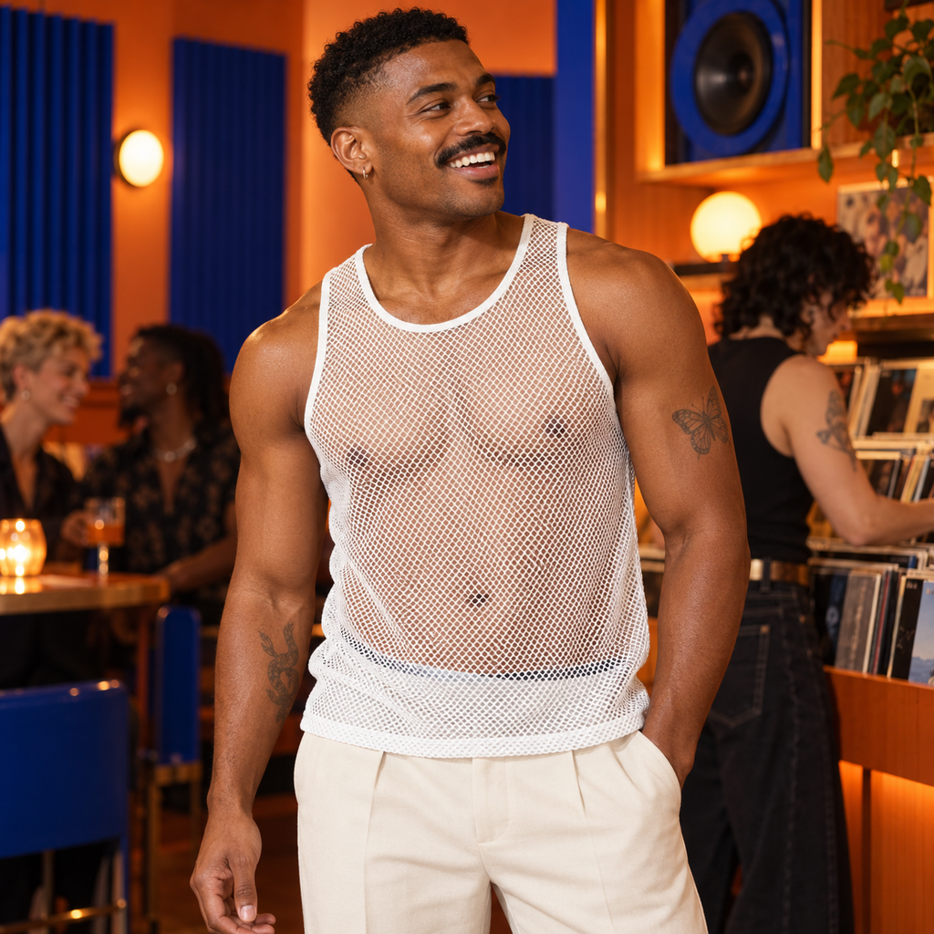 Men's Solid Network Hollow See-Through Thin Tank Top in White, worn by an adult model a tangerine listening bar with cobalt acoustic panels and a friend selecting vinyl.
