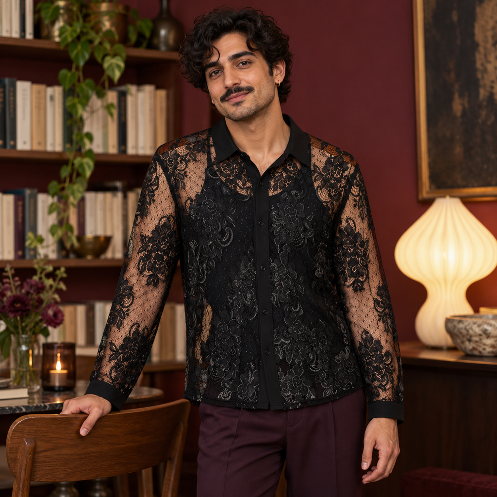 Man wearing a black floral lace long-sleeve shirt indoors.
