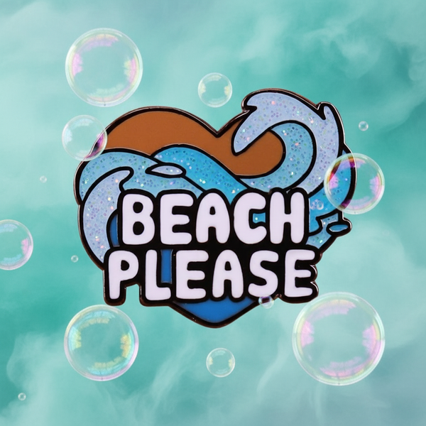 Beach Please Enamel Pin: Heart-shaped enamel pin with BEACH PLEASE text, featuring sand-brown and wave-blue halves, surrounded by pastel bubbles. Celebrate pride and self-expression with this joyful accessory.