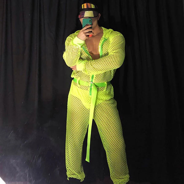 Person wearing a Hooded Fluorescent Neon Jumpsuit with a fishnet style and waist belt, capturing a mirror selfie. The jumpsuit exudes bold, proud self-expression, celebrating queer identity and visibility.