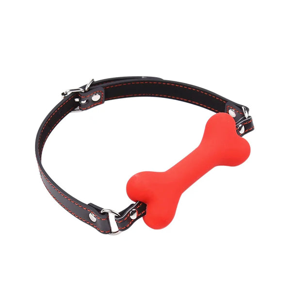 Black leather collar with red stitching and a bright red bone-shaped ball gag on a white background