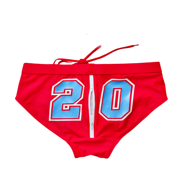 Open Up Design Swim Briefs feature bright red fabric, a front-center zipper, light blue 20, and a drawstring waistband, embodying bold self-expression and LGBTQIA+ pride with empowering style and visibility.