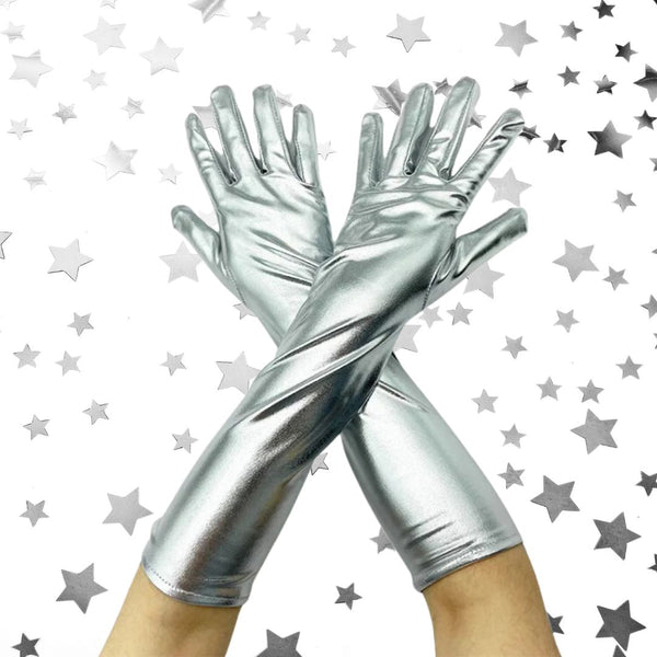 Metallic-silver Patent Shine Pole-Dance Gloves crossed at the wrists, exuding confidence and charm. These shiny synthetic leather gloves enhance grip and add a glamorous, empowering touch to any performance or outfit.