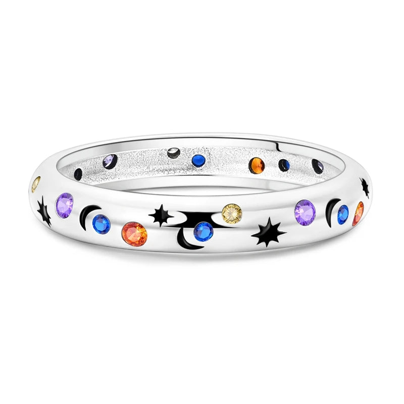 Silver-tone Cosmic Queer Energy ring with multicolour stones and star-and-moon motifs, close-up