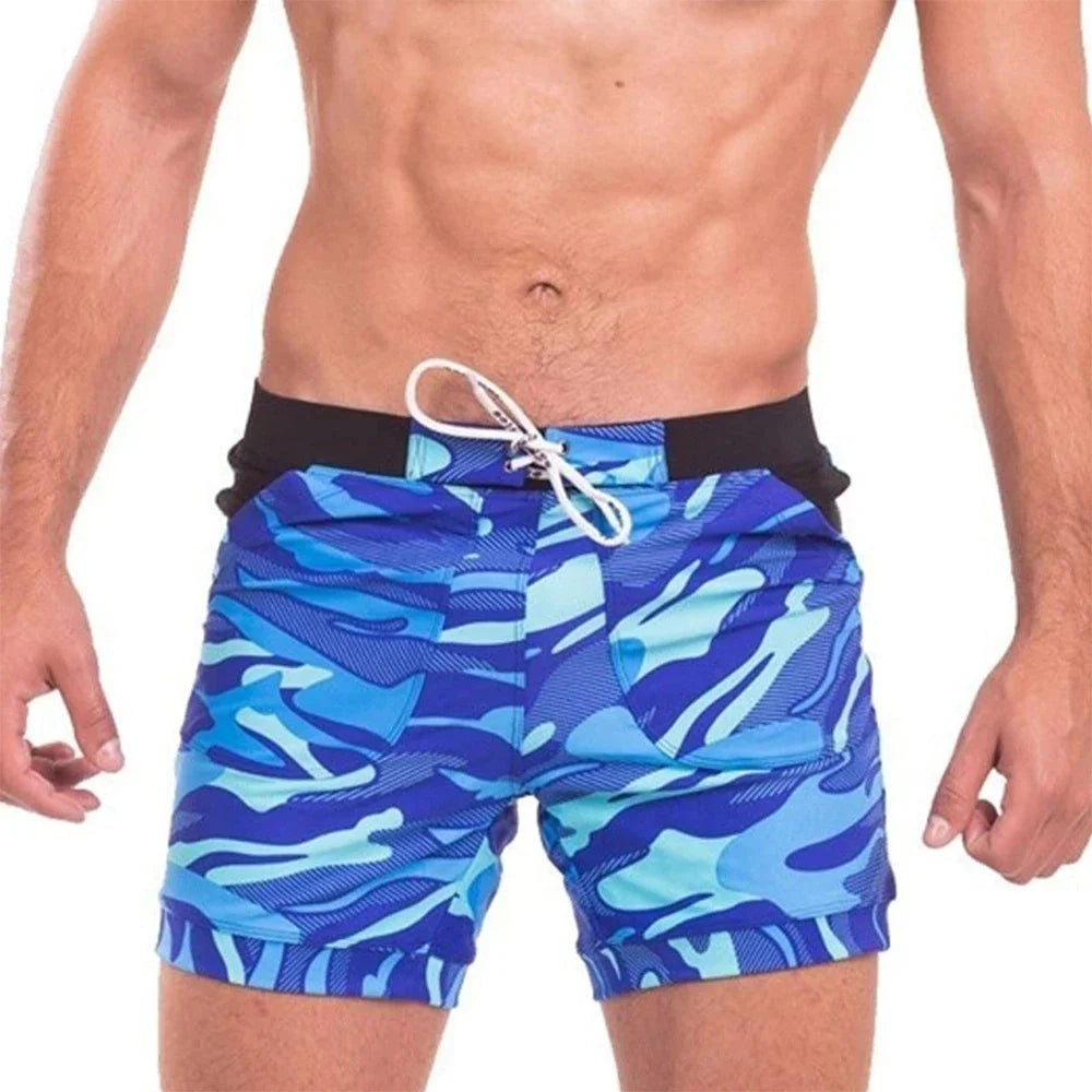 Light grey camouflage board shorts with side pocket and drawstring waist