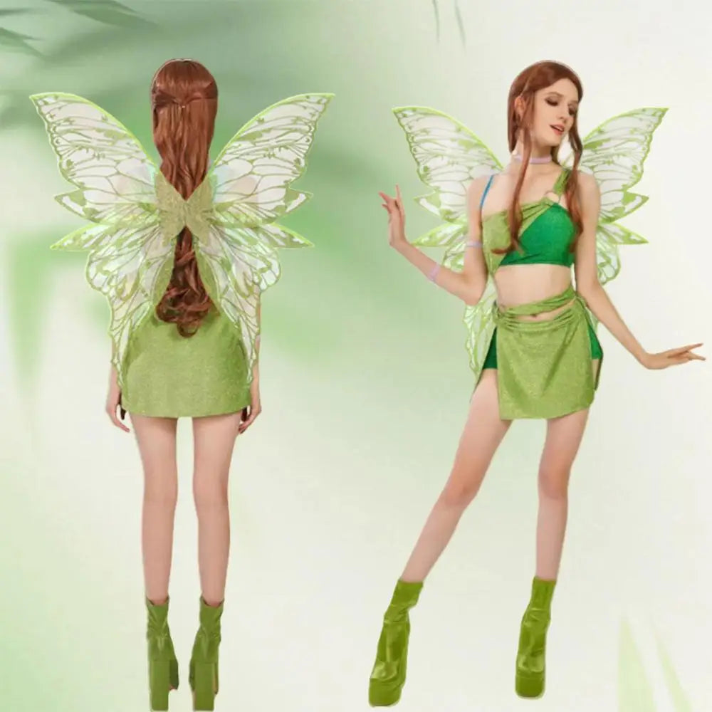 Model wearing the Ethereal Fairy Dress-Up Wings with shimmering green two-piece ensemble, translucent butterfly wings, and chunky platform boots, embodying magical, queer self-expression and empowerment.
