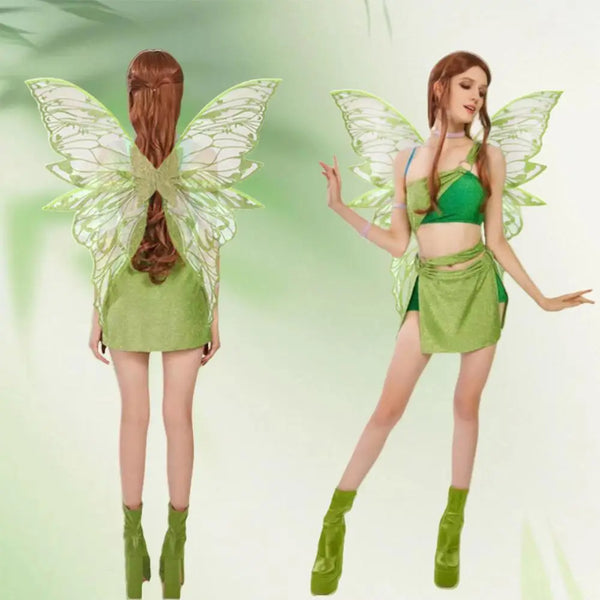Model wearing the Ethereal Fairy Dress-Up Wings with shimmering green two-piece ensemble, translucent butterfly wings, and chunky platform boots, embodying magical, queer self-expression and empowerment.
