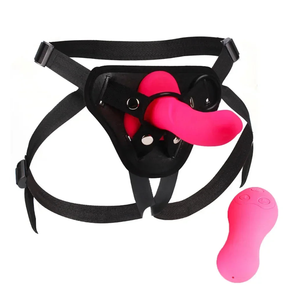 Black adjustable strap-on harness with bright pink dildo and separate vibrating bullet