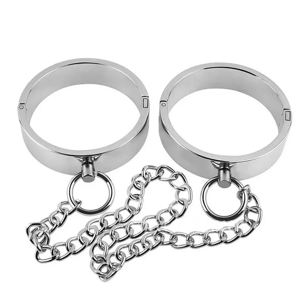 Chain Link Elegance Metallic Bondage Cuffs: Stainless steel shackles with a connecting chain, embodying bold style and confident, sensual exploration, designed for the queer community to celebrate self-expression and empowerment.