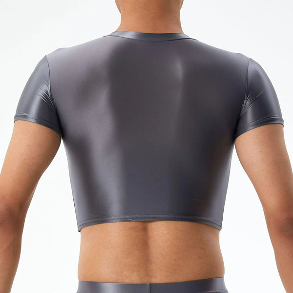 Back view of a dark gray short-sleeve crop top on a model, exposing the midriff