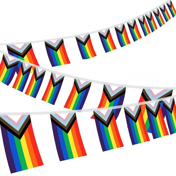 Progress Pride Flag Banners feature vibrant triangular flags with rainbow and chevron stripes, celebrating LGBTQIA+ unity and visibility. Strung on white cords, they're durable, empowering, and perfect for any prideful display.