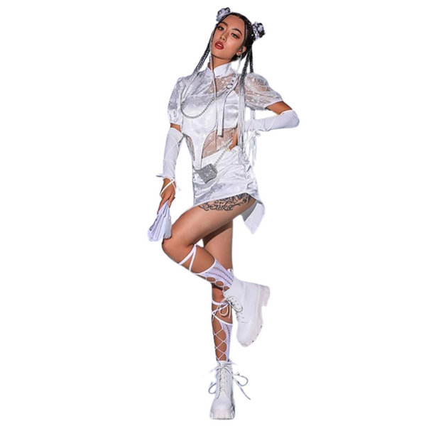 Young woman models the White Lace Hip Hop Outfit, showcasing asymmetrical mini-dress with lace details, space buns, and chunky boots, embodying bold, sexy self-expression with a touch of futuristic flair.