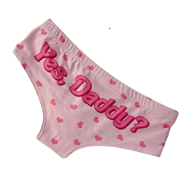 Yes, Daddy? Flirty Pink Love Briefs featuring light pink fabric with darker pink hearts and bold Yes, Daddy? text on back, crafted from silky polyester, embodying confident, playful, queer self-expression.
