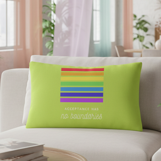 Lime green “Acceptance Has No Boundaries” pillow with rainbow stripes and bold white text on a beige sofa, pastel curtains