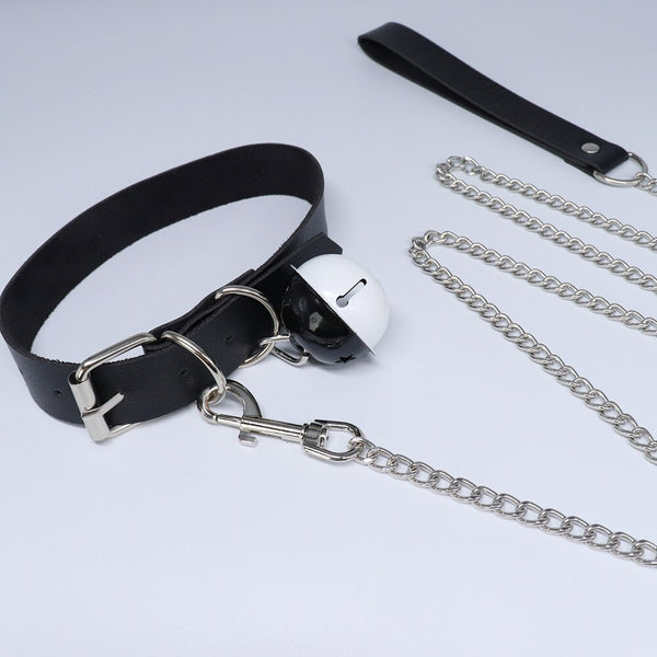 Black leather choker with silver bell, buckle, clip, and attached chain leash