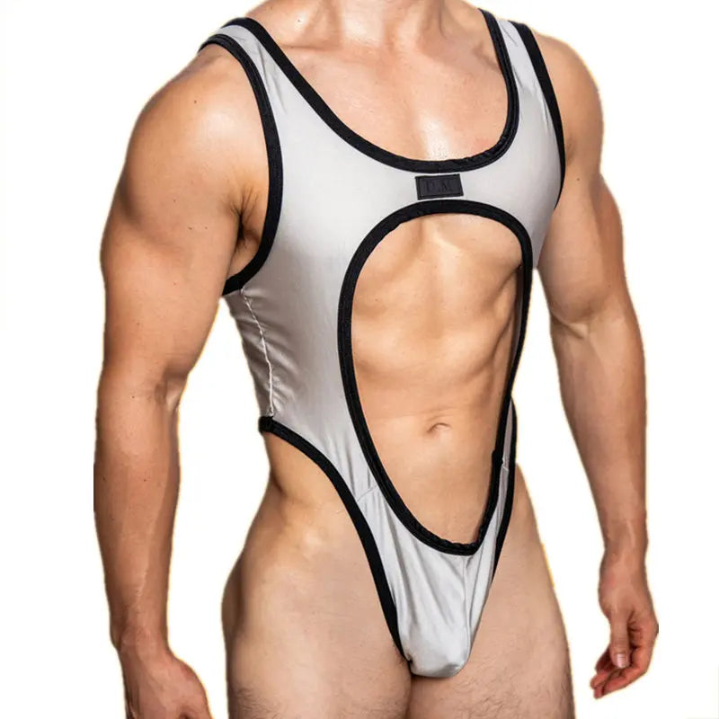 Front view of a muscular model wearing a silver cut-out bodysuit with black trim