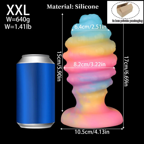 XXL multicolored silicone anal plug shown beside a blue cylindrical container with size measurements