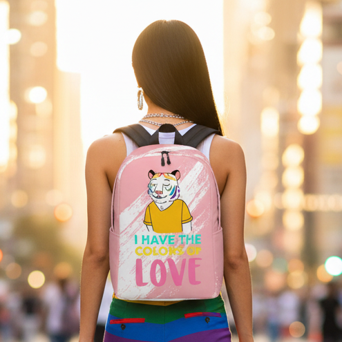 I Have The Color Of Love Minimalist Backpack" with a pink tiger graphic, rocked by a woman in a colorful queer striped skirt.