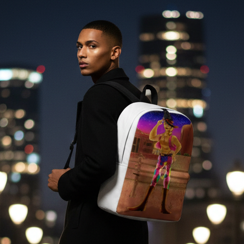 Gay Cowboy At Sunset Minimalist Backpack with bold cowboy art and a sunset palette, worn by a young man in a black coat at night.