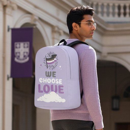 Asexual We Choose Love Minimalist Backpack with ace flag, heart, and cloud; worn by a queer man in lavender by columns.