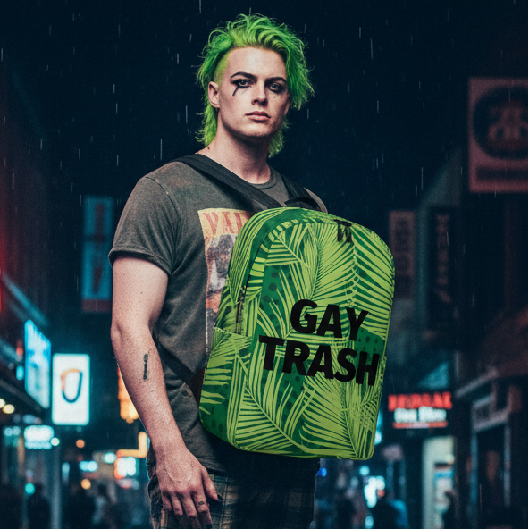 Minimalist backpack with "Gay Trash" in bold black text, carried by a neon-haired queer person on a rainy city street at night.
