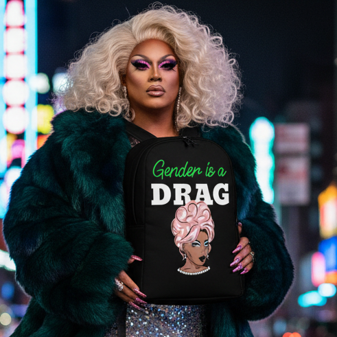 Gender Is A Drag Minimalist Backpack with a drag queen graphic and “Gender is a DRAG” slogan, held by a platinum blonde queen in bold makeup, teal fur coat, city at night.