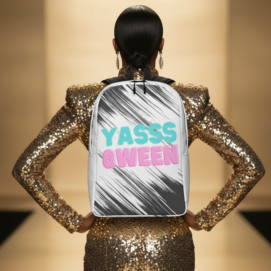 Minimalist backpack with bold "YASSS QWEEN" text on black and white stripes, rocked by someone in a gold sequined runway fit.