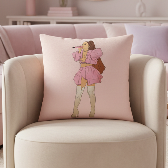Light pink Ariana Grande Pillow on modern armchair shows illustrated woman singing in short dress, tall boots, in queer chic decor.