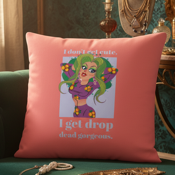 Drop Dead Gorgeous Pillow: pink cushion with cartoon woman, green hair, bold makeup; on green couch with jewelry and LGBT pride touches.