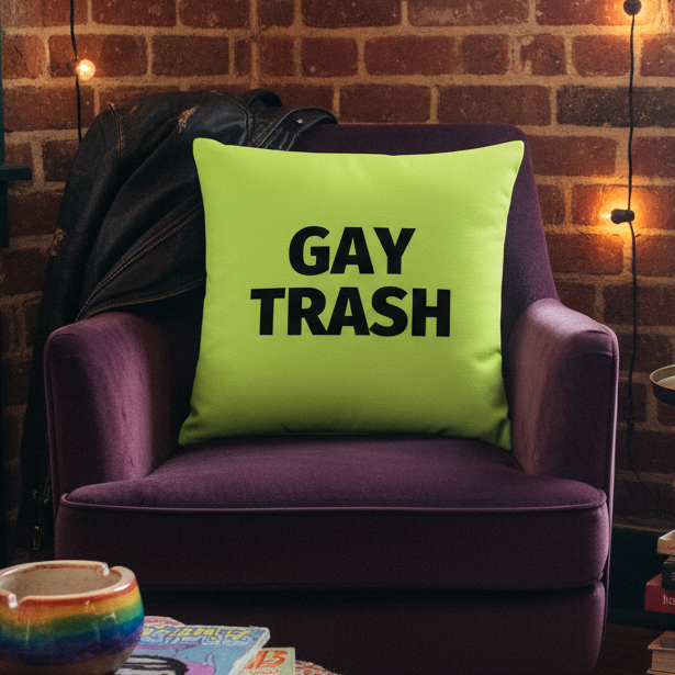 Neon green “Gay Trash” pillow with black text on a purple armchair and leather jacket; rainbow mug and string lights.