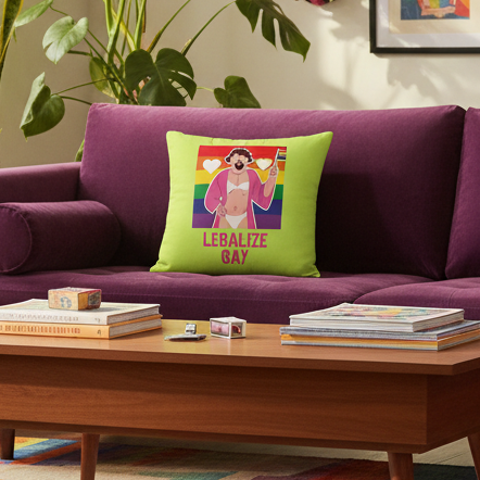 Lime green "LEBALIZE GAY" pillow with cartoon person, rainbow flag, and bottle on purple couch amid plants, books, and art.