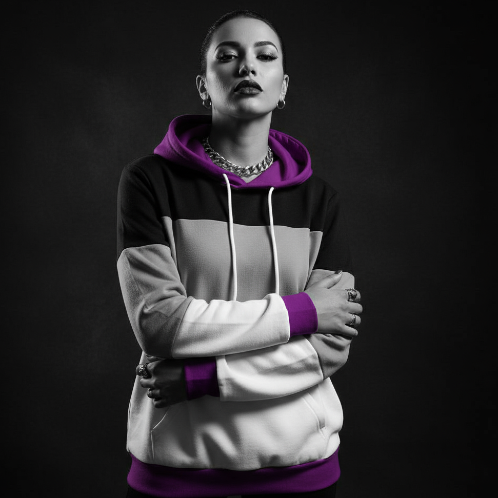 Front-facing model wearing a black, gray, white, and purple color-block hoodie