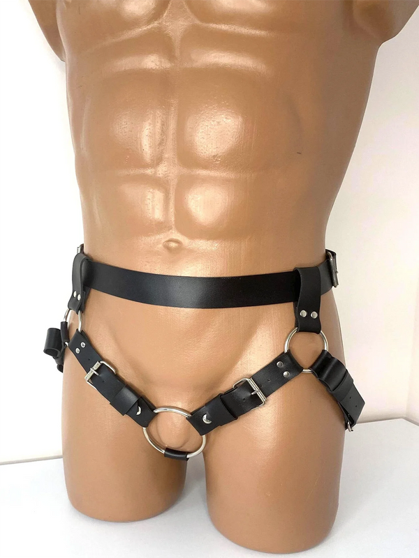 Front view of a black leather bondage harness on a tan mannequin, with rings and adjustable straps