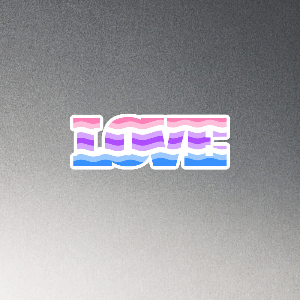 Flat-lay magnet reading “ICME” in pink, purple, and blue wavy stripes