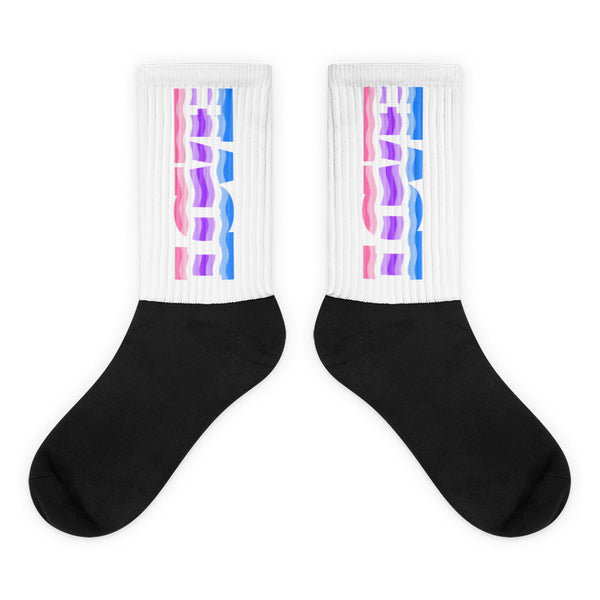 Pair of black-and-white crew socks with pink, purple, and blue abstract leg graphics