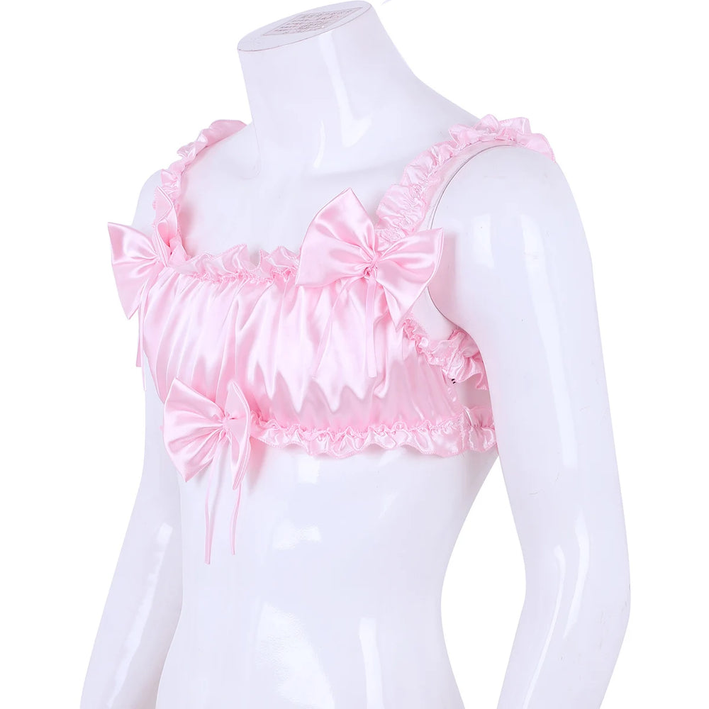 Front three-quarter view of a pink satin ruffled crop top on a mannequin