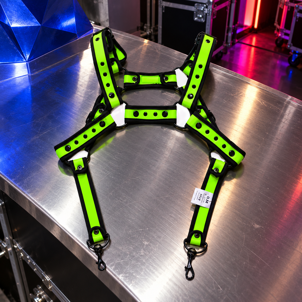 Fusion Shoulder Strap Metallic Buckle Harness in Green, photographed in a sculptural ARTPOP CHAOS backstage setting.