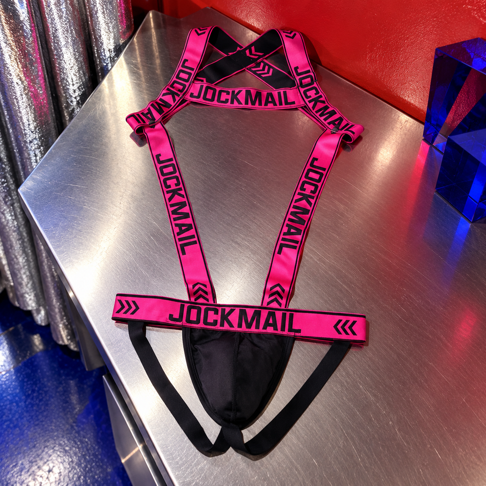 Jockmail Neon Seduction Bodysuit & Thong Harness in Lust, styled in an ARTPOP CHAOS backstage setting.