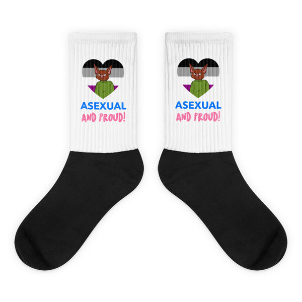 Pair of black-and-white crew socks reading “ASEXUAL AND PROUD!” with a cat over an ace flag