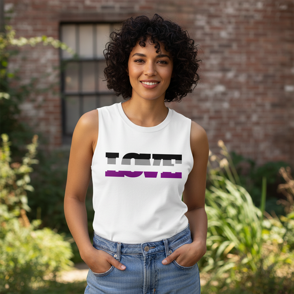 A relaxed-fit Asexual Love Muscle Top with “LOVE” in ace flag black, gray, white, and purple; person poses hands-in-pockets
