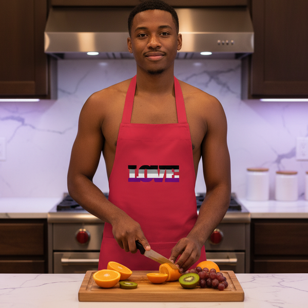 Person wearing a red LOVE apron while slicing fruit in a kitchen
