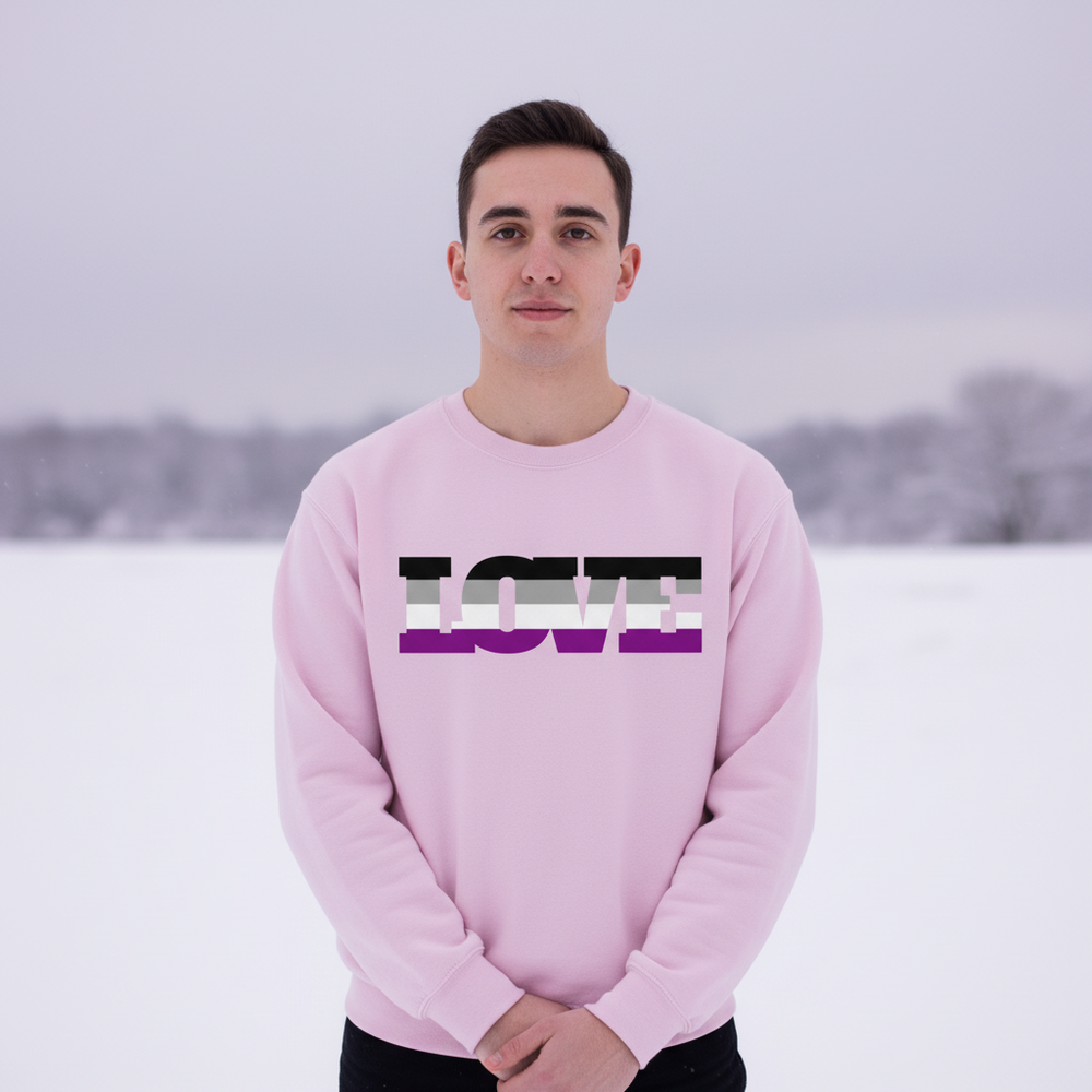 Front-facing model in a pink sweatshirt with LOVE in black, gray, white, and purple stripes, outdoors in snow