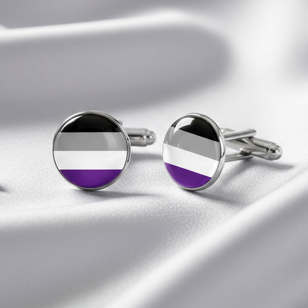 Pair of round silver cufflinks with black, gray, white, and purple stripes